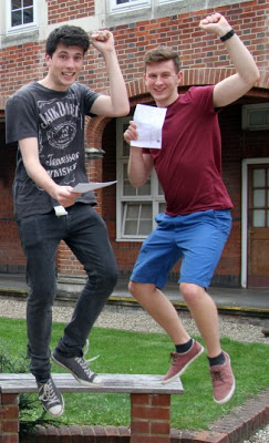 Boys jumping for joy after exam results 